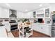 Bright kitchen featuring stainless appliances, marble backsplash and kitchen island at 6628 Londonderry Dr, Morrow, GA 30260