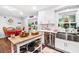 Updated kitchen featuring white cabinets, stainless sink, and modern appliances at 6628 Londonderry Dr, Morrow, GA 30260