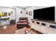 Cozy living room with dark laminate floors and entertainment center at 6628 Londonderry Dr, Morrow, GA 30260
