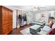 Comfortable living room with a blue sofa, wooden floors and ample closet space at 6628 Londonderry Dr, Morrow, GA 30260
