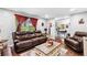Living room showcases warm seating, natural light, and new laminate flooring at 6628 Londonderry Dr, Morrow, GA 30260