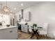 Modern kitchen with stainless steel appliances, breakfast bar, and adjacent dining area at 1408 Cozy Court # 303, Atlanta, GA 30315