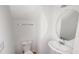 A small half-bath with a toilet, sink and vanity at 176 Silver Fox Trl, Dallas, GA 30157