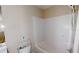 Bathroom featuring a bathtub with shower head and toilet at 176 Silver Fox Trl, Dallas, GA 30157