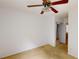 Bedroom featuring a ceiling fan with lighting fixture and a mirrored closet door at 176 Silver Fox Trl, Dallas, GA 30157
