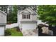 Two-story home with a one car garage and a well-maintained lawn at 176 Silver Fox Trl, Dallas, GA 30157