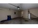 A standard two car garage with garage door openers and concrete floor at 176 Silver Fox Trl, Dallas, GA 30157