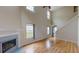 Bright living room with hardwood floors, fireplace, and large windows at 176 Silver Fox Trl, Dallas, GA 30157
