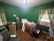 Bedroom features wood floor, bed, desk, and window at 301 Sisson Ne Ave, Atlanta, GA 30317