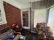 Sun Room with brick and wood paneled walls at 301 Sisson Ne Ave, Atlanta, GA 30317