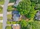 Aerial view of a home with a manicured lawn and mature trees at 4780 Agate Dr, Johns Creek, GA 30022