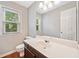 Bathroom with updated vanity, large mirror, and natural light at 4780 Agate Dr, Johns Creek, GA 30022