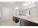 Bathroom offers a large double sink vanity, great mirrors, lighting and tile floors at 4780 Agate Dr, Johns Creek, GA 30022