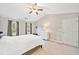 Bedroom featuring vaulted ceilings, carpet, two windows and white dresser at 4780 Agate Dr, Johns Creek, GA 30022