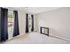 Bedroom with neutral paint, carpeted floor, and natural light at 4780 Agate Dr, Johns Creek, GA 30022