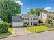 Traditional home boasting lush landscaping, mature trees, a two-car garage, and a serene neighborhood setting at 4780 Agate Dr, Johns Creek, GA 30022