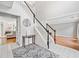 Open foyer with tile flooring, staircase, and sightlines to the living room and dining room at 4780 Agate Dr, Johns Creek, GA 30022