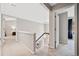 Bright hallway with views of stairwell and bedrooms at 4780 Agate Dr, Johns Creek, GA 30022
