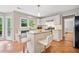 Spacious kitchen with an island, breakfast bar, and views to backyard at 4780 Agate Dr, Johns Creek, GA 30022