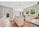 Well-lit kitchen with an island bar and modern appliances at 4780 Agate Dr, Johns Creek, GA 30022