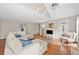 Bright living area boasts hardwood floors, a vaulted ceiling, and a seamless transition to the outdoor patio at 4780 Agate Dr, Johns Creek, GA 30022