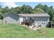 A lovely backyard with a deck, fire pit, and plenty of green space at 8321 Banks Mill Rd, Douglasville, GA 30135