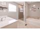 Bathroom featuring a glass shower and soaking tub at 8321 Banks Mill Rd, Douglasville, GA 30135