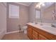 This bathroom features double sinks and shower-tub combo at 8321 Banks Mill Rd, Douglasville, GA 30135