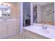 Bathroom with dual vanities and a view of the closet at 8321 Banks Mill Rd, Douglasville, GA 30135