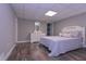 Cozy bedroom featuring a white dresser and plush bed at 8321 Banks Mill Rd, Douglasville, GA 30135