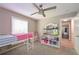 Bedroom featuring a loft bed, playful decor, and a ceiling fan at 8321 Banks Mill Rd, Douglasville, GA 30135
