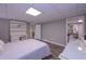 Bedroom with white furniture, adjacent office space, and lots of natural light at 8321 Banks Mill Rd, Douglasville, GA 30135