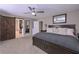 Bedroom with barn door, ceiling fan, and closet at 8321 Banks Mill Rd, Douglasville, GA 30135