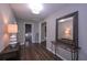 Stylish foyer featuring hardwood floors, a decorative mirror, and ample natural light at 8321 Banks Mill Rd, Douglasville, GA 30135