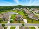 Aerial shot of a home nestled in a community with a pond and lush trees, showcasing the property's desirable location at 847 Rolling Hill, Kennesaw, GA 30152