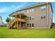 Expansive backyard featuring a covered deck with stairs, offering an ideal space for relaxation and gatherings at 847 Rolling Hill, Kennesaw, GA 30152