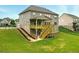 Spacious backyard featuring a wooden deck with stairs leading to the ground, perfect for outdoor entertaining at 847 Rolling Hill, Kennesaw, GA 30152