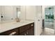 Bathroom boasts a granite vanity top and a view into an airy, light-filled bedroom at 847 Rolling Hill, Kennesaw, GA 30152
