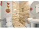 Modern bathroom with walk-in shower featuring neutral toned tile and stylish fixtures at 847 Rolling Hill, Kennesaw, GA 30152