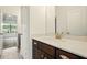 Bathroom features tile flooring, dark wood vanity and a view to the bedroom at 847 Rolling Hill, Kennesaw, GA 30152