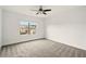 Bright bedroom with neutral carpet, ceiling fan, and natural light from the window at 847 Rolling Hill, Kennesaw, GA 30152