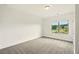 Bright bedroom with neutral carpet and a large window offering a view of the yard at 847 Rolling Hill, Kennesaw, GA 30152
