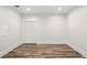 Bright bedroom featuring hardwood floors and a closet with white doors at 847 Rolling Hill, Kennesaw, GA 30152