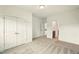 Bright bedroom featuring neutral carpet, double door closet, and view to additional rooms at 847 Rolling Hill, Kennesaw, GA 30152