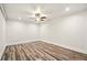 Bright bedroom features modern ceiling fan, recessed lighting, and hardwood floors at 847 Rolling Hill, Kennesaw, GA 30152