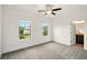 This bedroom is naturally well lit, and features neutral carpet and an en suite bathroom at 847 Rolling Hill, Kennesaw, GA 30152
