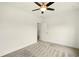 An airy bedroom features neutral carpet, ceiling fan, and access to walk in closet at 847 Rolling Hill, Kennesaw, GA 30152