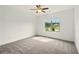An empty bedroom with carpet and a window view of a lake and backyard at 847 Rolling Hill, Kennesaw, GA 30152