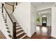 Entryway featuring hardwood floors, staircase, and a view into the living area at 847 Rolling Hill, Kennesaw, GA 30152