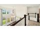 Upstairs foyer with railing overlooking main level, chandelier, and multiple windows for natural light at 847 Rolling Hill, Kennesaw, GA 30152